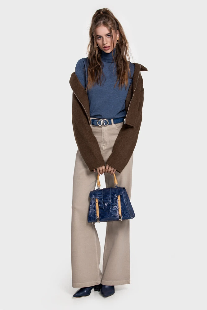 Steel-blue turtleneck with a brown wool jacket, beige wide jeans and a navy croc handbag